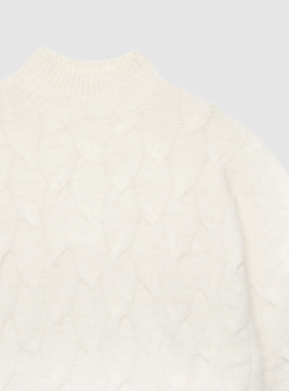Jersey de punto trenzado con cuello alto