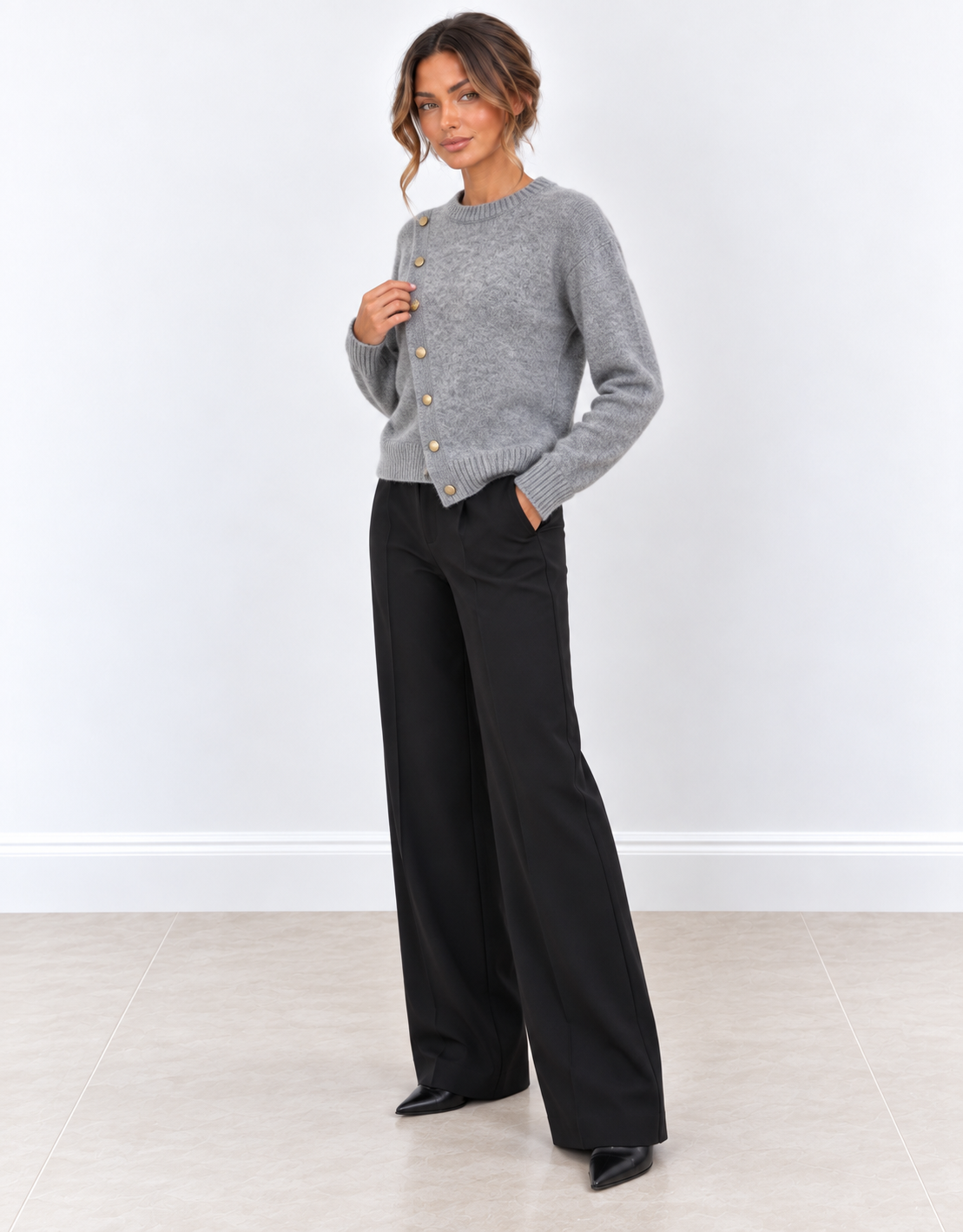 Jersey gris de punto con botones laterales